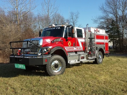 Rescue pumper front-left exterior view with grille guard, bumper winch area, and side compartments