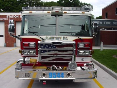 Front exterior view showing grille, bumper, and warning lights