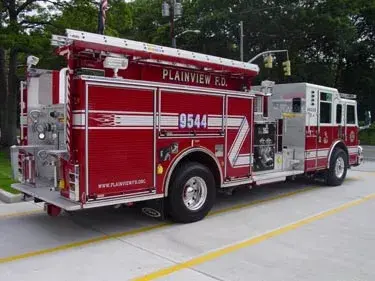 Rear-left exterior view showing side hosebed rails and rear body
