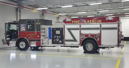 Rescue pumper side profile view showing full body and closed compartments