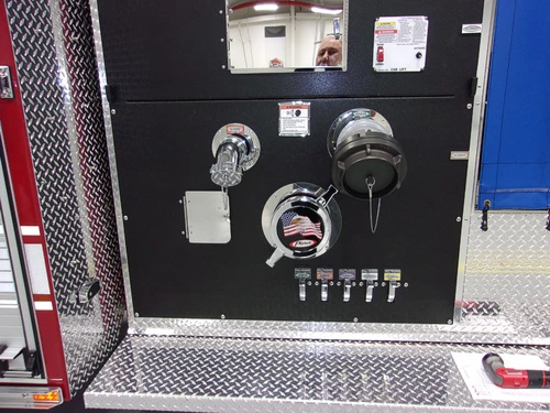 Pump-side control panel close-up showing gauges, valves, and labels