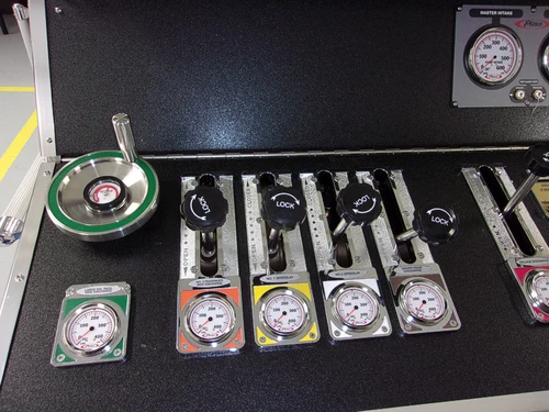 Open drawer close-up showing nozzles, adapters, and equipment fittings