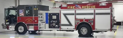 Rescue pumper driver-side profile view showing full apparatus length