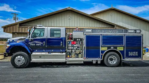 Driver-side full profile showing rescue body and rear wheel area