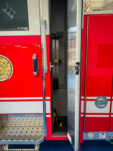 Cab side close-up showing door panel, trim, and side step area