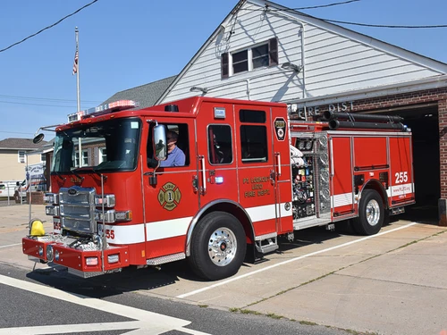 Pumper front-left exterior view showing grille, bumper, and enclosed cab
