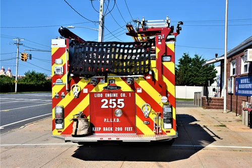 Rear view showing red-and-yellow chevrons and hosebed area