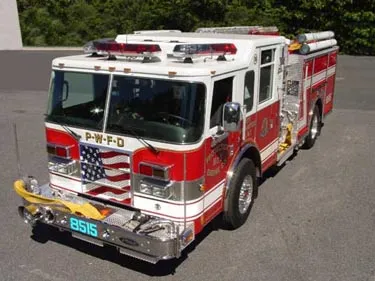 High front-left exterior view showing bumper, cab, and side compartments