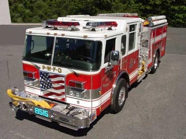 High front-left exterior view showing bumper, cab, and side compartments
