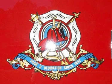 Side emblem close-up showing crest logo on red panel