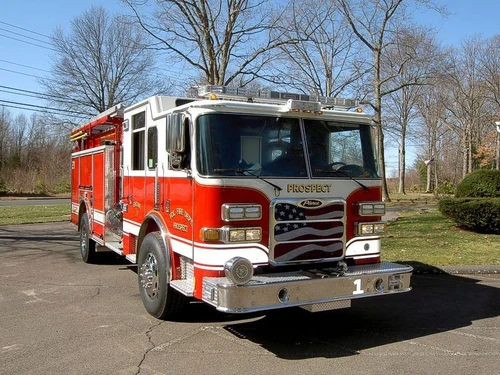 Pumper front-left exterior view showing enclosed cab and side compartments