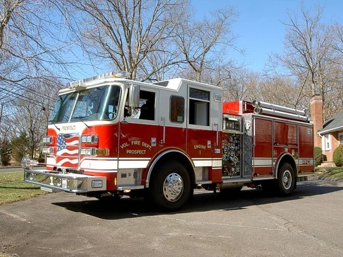 Front-right exterior view showing bumper, cab, and side body