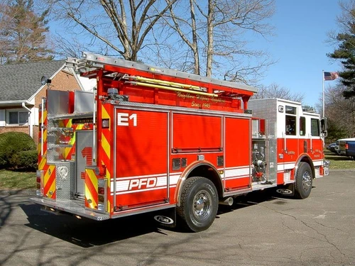 Rear-right exterior view showing side hosebed rails and rear body panel
