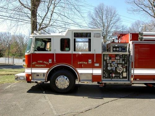Driver-side profile with open pump panel showing gauges and valves