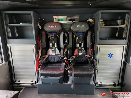 Rear crew interior view showing seat backs and aisle space