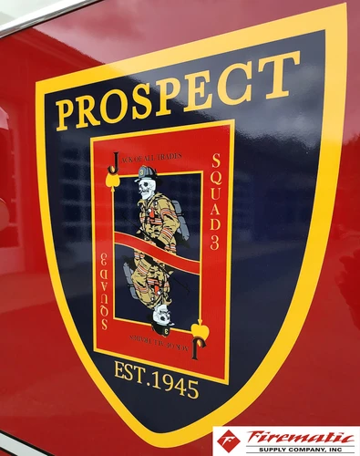 Cab door crest close-up showing shield-style company emblem