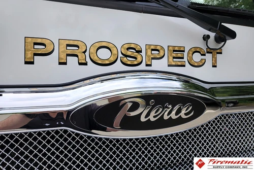 Front grille close-up showing raised script and Pierce emblem