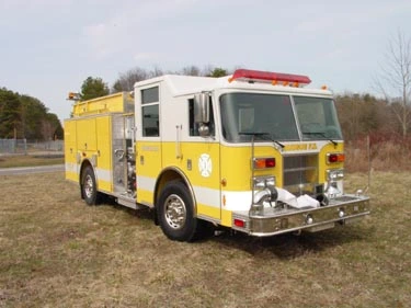 Pumper front-left exterior view showing bumper, cab, and side compartments
