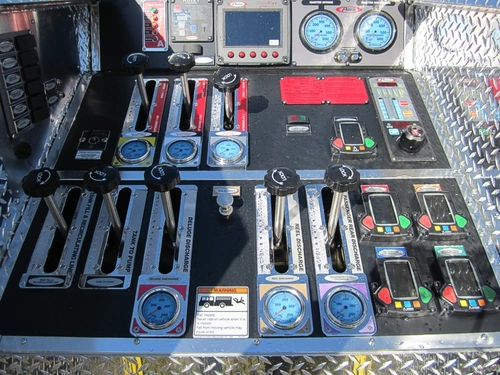 Control panel close-up showing rocker switches, indicator lights, and labels