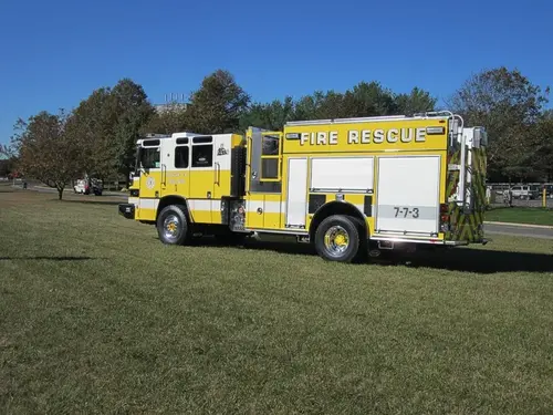 Driver-side full profile view showing long rescue body and wheelbase