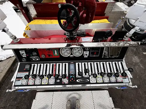 Rear control panel close-up showing intake valves, outlets, and metal deck