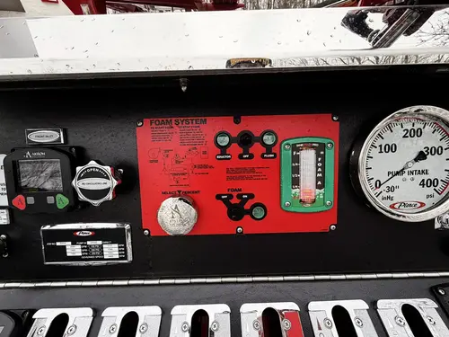 Pump panel close-up showing gauge cluster and polished control surface