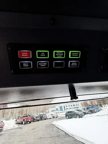 Crew cab interior view showing forward-facing rear seats and restraints