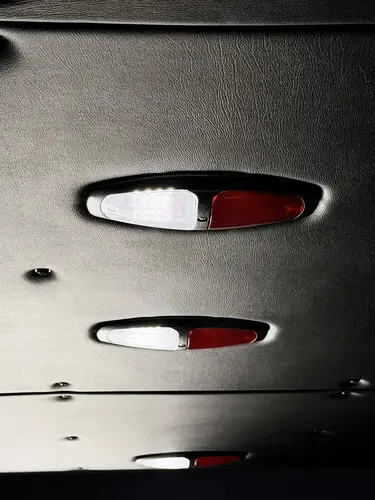 Open side compartment with pull-out tray showing mounted rescue tools
