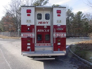 Rear view showing dual rear doors with chevrons and centered unit lettering