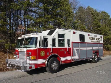 Heavy rescue truck front-left exterior view showing chrome bumper and grille