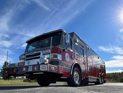 Heavy rescue truck front-left exterior view showing black upper body and long chassis