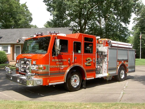 Pumper front-left exterior view showing enclosed cab and side compartments