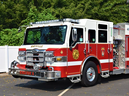 Pumper front-left exterior view showing grille, bumper, and enclosed cab