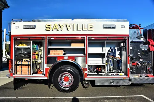 Officer-side full profile showing multiple open compartments and equipment layout