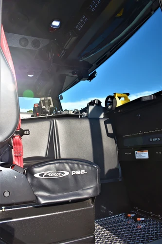 Cab interior side view showing seating, door opening, and interior trim