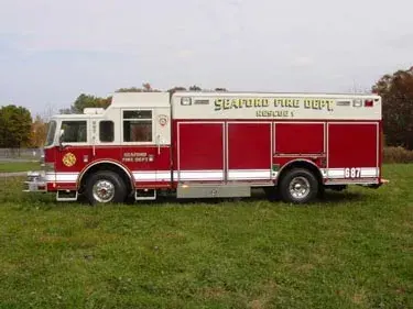Driver-side profile view showing long body compartments and wheel area