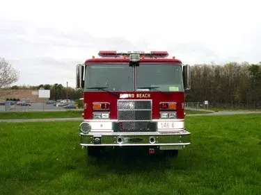 Front exterior view showing grille, bumper, and warning lights
