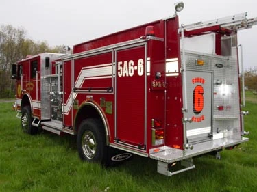 Rear-right exterior view showing rear compartment, side body, and wheel area