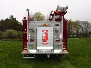 Rear view showing rear door, warning lights, and hosebed area