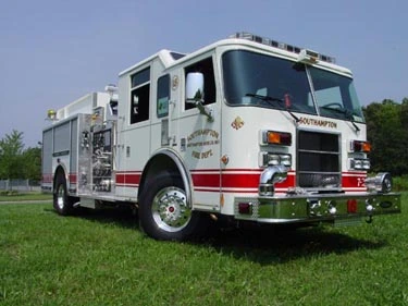Pumper-tanker front-left exterior view showing enclosed cab and side compartments