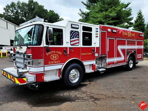 Pumper front-left exterior view showing enclosed cab and side body