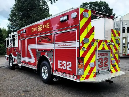 Rear-left exterior view showing side body and rear chevrons