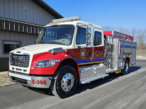 Rescue pumper front-left exterior view showing enclosed cab and side body