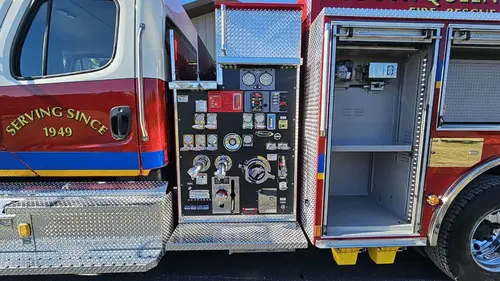 Pump-side compartment view showing controls, gauges, and open side bay