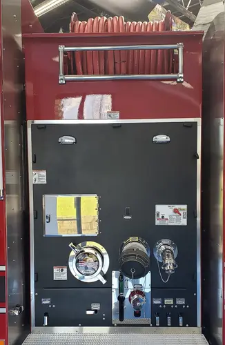 Rear control panel close-up showing gauges, valves, and hose connections