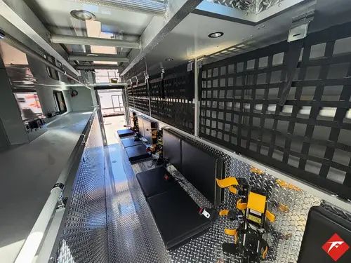 Walk-in rescue interior view showing long aisle and equipment mounting channels