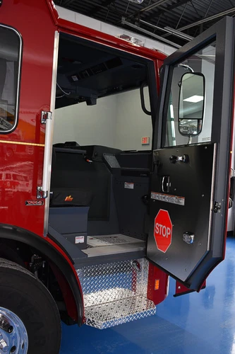 Cab door open view showing stepwell and lower interior trim