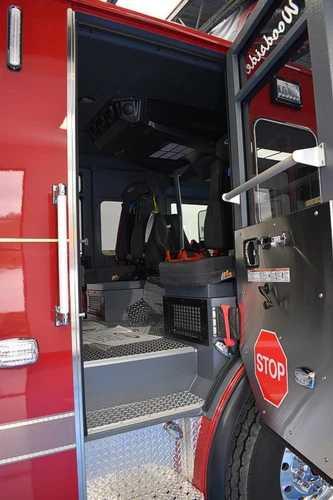 Cab side door open view showing stepwell and seat base area