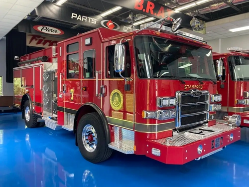Pumper front-left exterior view showing grille, bumper, and side body