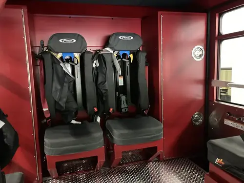 Rear crew seat close-up showing SCBA seats and restraint mounts